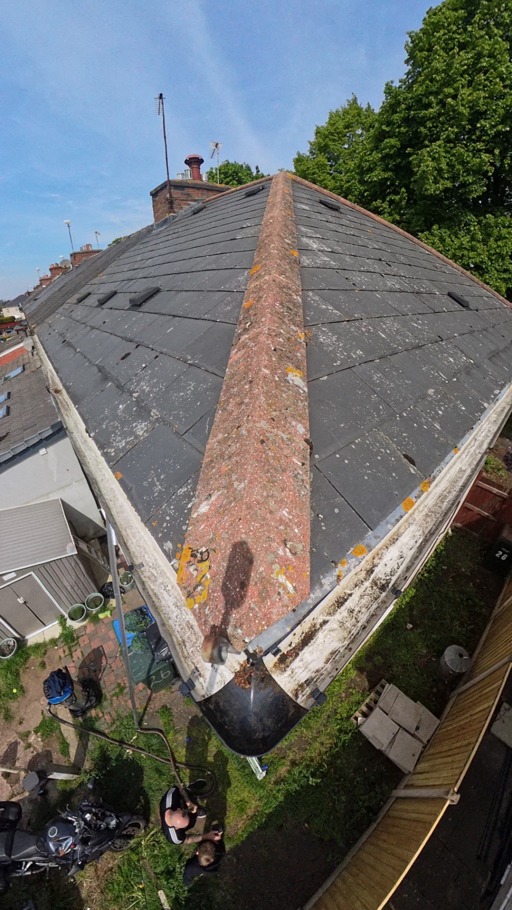 Roof moss visible during a real gutter camera inspection